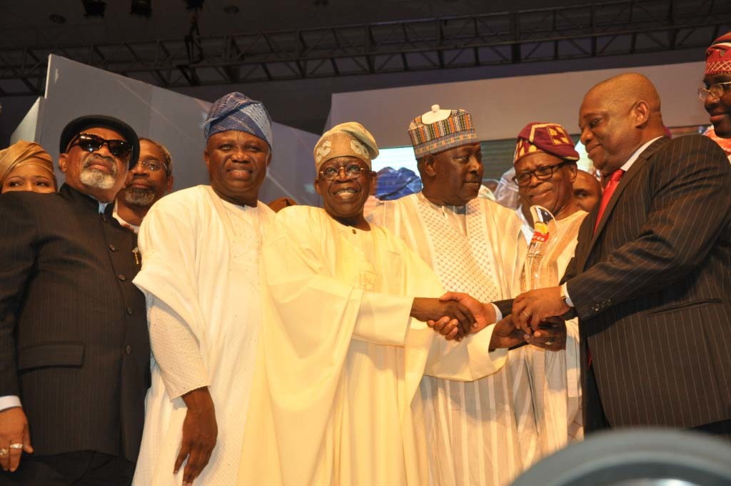 R-L .Chairman/ Publisher, The Sun Newspaper/ Former Governor of Abia State, Dr. Orji Uzor Kalu, Presenting the Sun Man of the year Award to the Former Governor of Lagos State, Bola Ahmed Tunubu, with them are APC National Chairman, Odigie oyegun, Secretary to the Federal Government, Babachir David Lawal, ,Lagos State Governor, Akinwunmi Ambode and Minister of Labour, Chris Ngige
