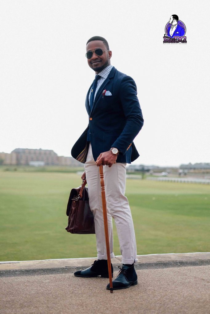 Pride Nigeria Magazine's Rare and Debonair Gentleman, Mary Olan Photography, Chukwuemeka Ayiam-Osigwe Nigerian Male Fashion blogger, what to wear to a boat regatta, how to wear a navy blue blazer, how to wear chukka chukkar boots stylishly, 6 pairs of shoes every black coloured man needs and why, the desert boot vs the chukka boot what are their origins similarities and dissimilarities ?
